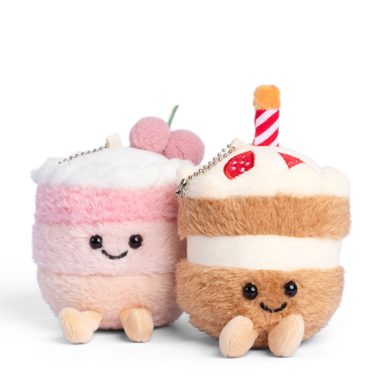 Pink cake and chocolate cake plush keychain with smiling faces designed as cute dessert themed collectable bag charms