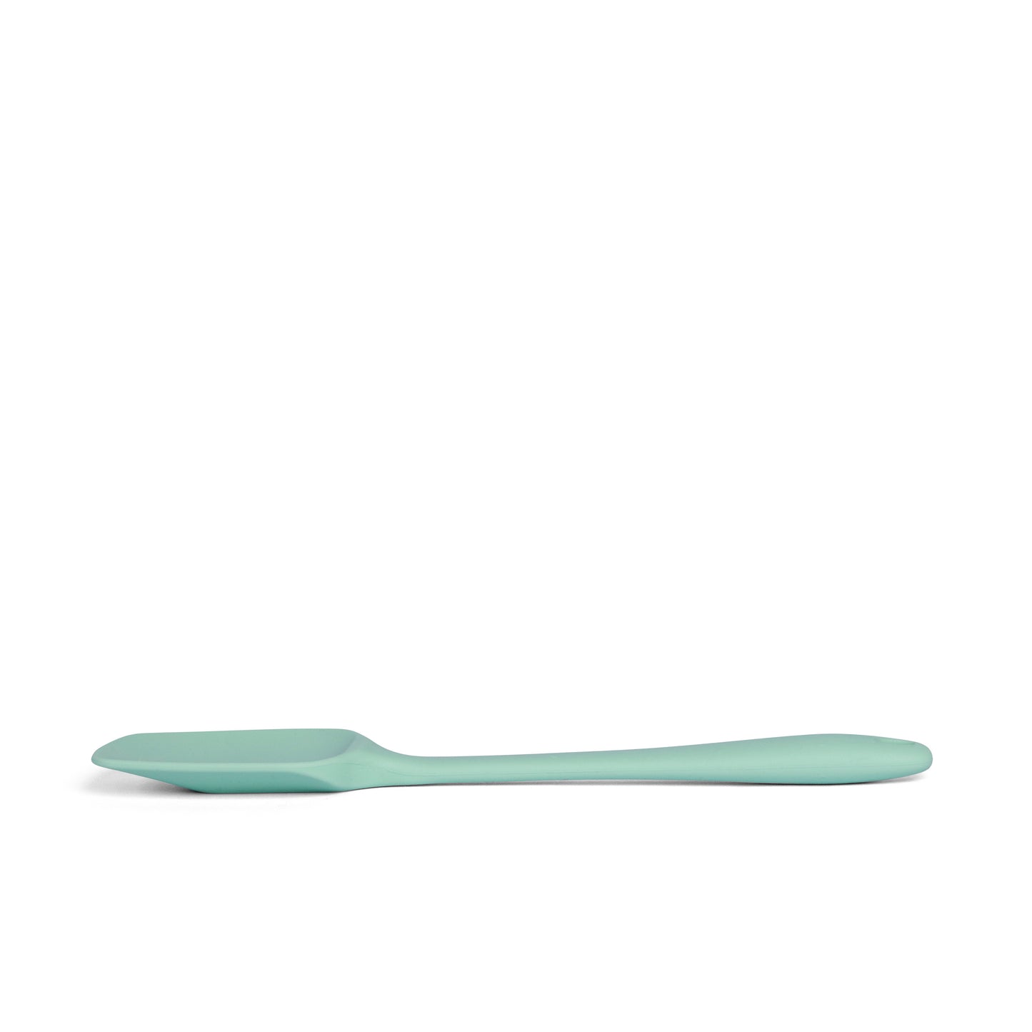 Mint green silicone spoon side view on a white background 
