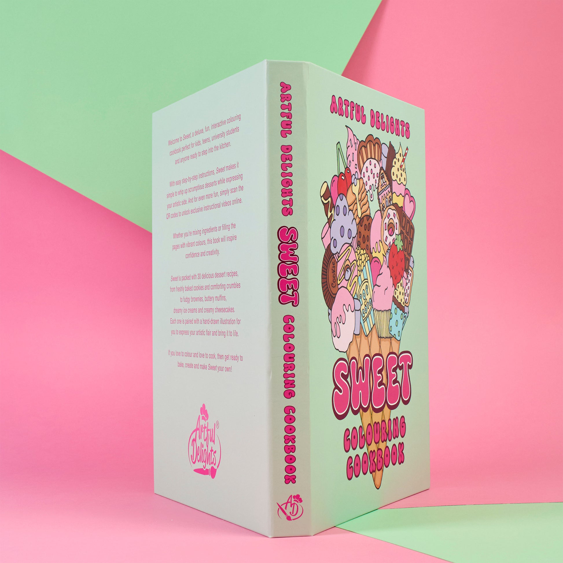 Book titled 'Sweet Colouring Cookbook' on a pink and green background