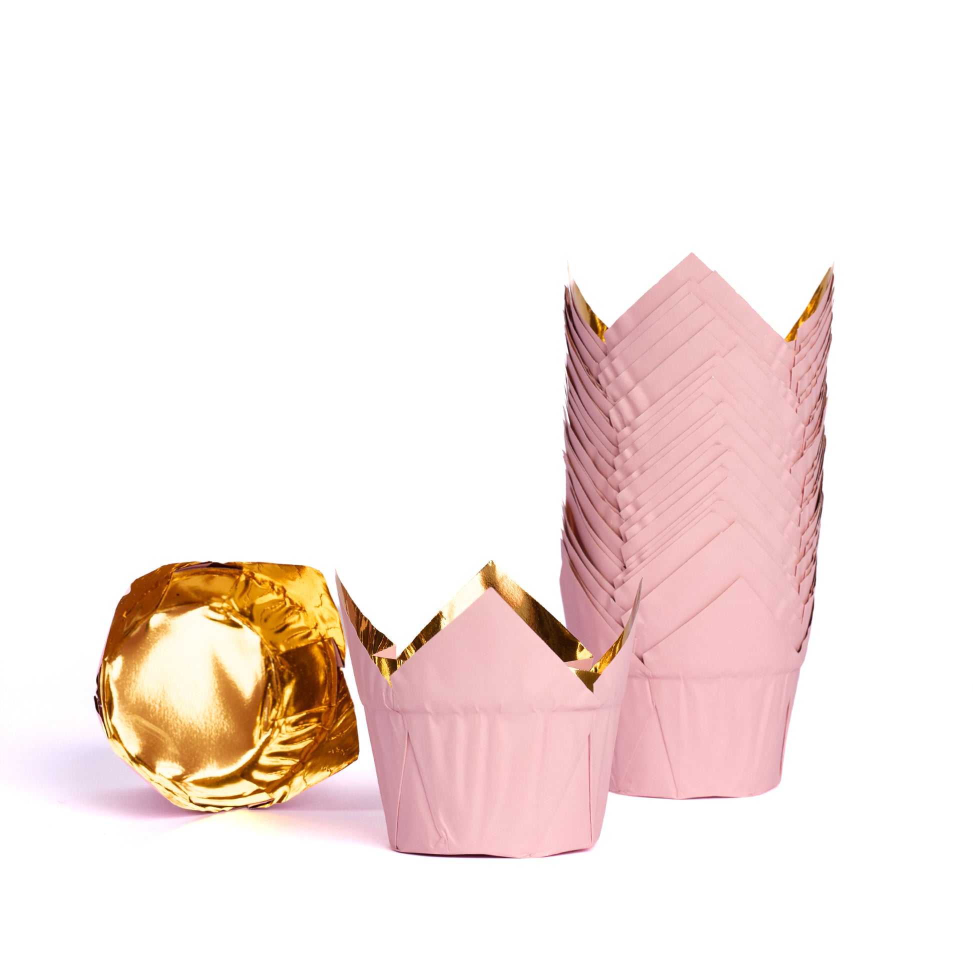 Pink and gold muffin cases in a stack with individual baking cases displayed on a white background